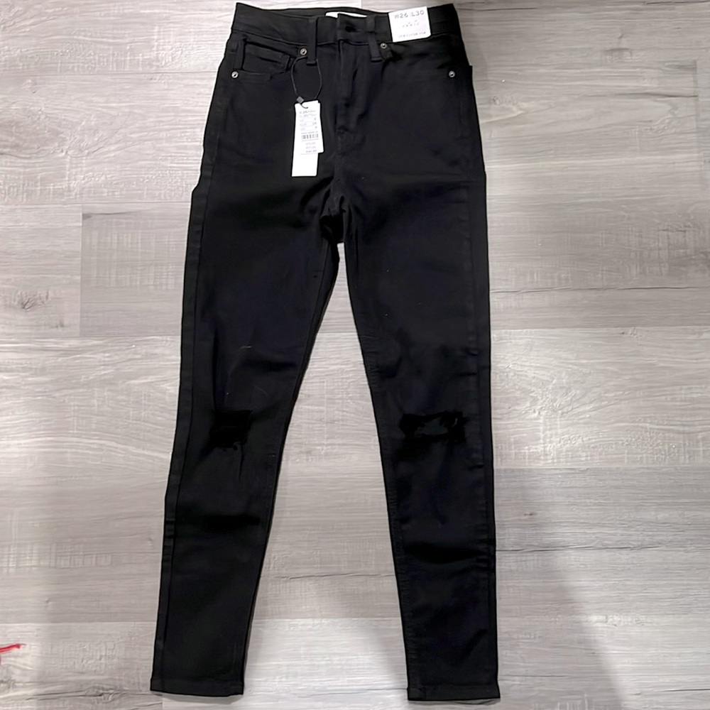 Brand new with tags topshop Jamie jeans. Black with rips on the knees. US size 4